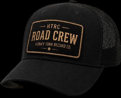 The black HTRC Founding Road Crew trucker hat, with a gold Road Crew patch on the front panel.